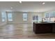 The spacious living room flows into the kitchen, creating an open and inviting floor plan at 93 Steel Springs Ln, Angier, NC 27501