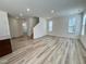 Open-concept living area showcases hardwood floors and natural light, perfect for entertaining at 93 Steel Springs Ln, Angier, NC 27501