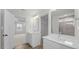 Bright bathroom with double vanity, large mirrors, and modern fixtures at 1009 Shovelhead Dr # 5, Durham, NC 27703