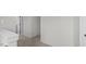 Bright upstairs hallway features soft carpet and neutral walls, creating a seamless transition at 1009 Shovelhead Dr # 5, Durham, NC 27703