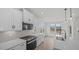 Bright kitchen features modern appliances, white cabinetry, and stylish pendant lighting at 1009 Shovelhead Dr # 5, Durham, NC 27703