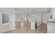 Open kitchen showcasing stainless steel appliances, light countertops and adjacent living space at 1009 Shovelhead Dr # 5, Durham, NC 27703