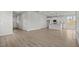 Spacious living room with hardwood floors leading to a modern kitchen area at 1009 Shovelhead Dr # 5, Durham, NC 27703