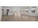 Open living space with large windows, flowing into the kitchen and dining area at 1009 Shovelhead Dr # 5, Durham, NC 27703