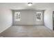 Bright and spacious empty room with neutral carpet and dual windows that provide ample natural light at 106 Canvasback Dr, Durham, NC 27704
