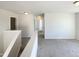 Hallway view on the 2nd floor featuring neutral carpet and white doors at 106 Canvasback Dr, Durham, NC 27704