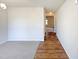 Open hallway featuring hard wood flooring and carpet, connecting to the rooms of the house at 106 Canvasback Dr, Durham, NC 27704