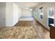 Spacious open-concept area with wood-look flooring, natural lighting, and flow to the living space at 106 Canvasback Dr, Durham, NC 27704