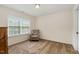 Comfortable bedroom featuring a plush chair near the window, providing a relaxing space at 110 White Burley Ct, Durham, NC 27703
