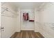 Walk-in closet with shelving and rod for optimal storage space in this home at 110 White Burley Ct, Durham, NC 27703