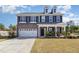 Charming two-story home with a two-car garage, black shutters, and manicured front lawn at 110 White Burley Ct, Durham, NC 27703