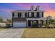Charming two-story home with a well-manicured lawn, driveway, and a welcoming entrance at 110 White Burley Ct, Durham, NC 27703