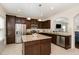 Modern kitchen featuring a center island, stainless steel appliances, and warm lighting at 110 White Burley Ct, Durham, NC 27703