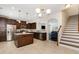 Well-equipped kitchen with dark wood cabinetry, stainless steel appliances, and granite countertops at 110 White Burley Ct, Durham, NC 27703