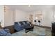 Cozy living room featuring a blue sofa, a colorful rug, and an open layout at 110 White Burley Ct, Durham, NC 27703