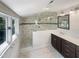 Beautiful bathroom featuring a glass shower, modern vanity, and bright natural light from a window at 112 Old Bridge Ln, Chapel Hill, NC 27517