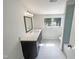 Renovated bathroom with large vanity and bathtub with blue tiles at 112 Old Bridge Ln, Chapel Hill, NC 27517