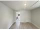 Spacious bedroom with light hardwood floors and open doorway at 112 Old Bridge Ln, Chapel Hill, NC 27517