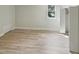 Bright bedroom with light hardwood floors, closet and window at 112 Old Bridge Ln, Chapel Hill, NC 27517