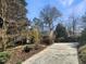 Charming home with mature trees, landscaping, and a long driveway at 112 Old Bridge Ln, Chapel Hill, NC 27517