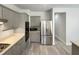 Modern kitchen with stainless steel appliances and gray cabinets at 112 Old Bridge Ln, Chapel Hill, NC 27517