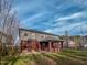 Backyard with a covered patio and a mix of brick and siding on the house at 1171 Jackson Ct, Creedmoor, NC 27522