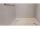 Close up of the bathtub with a metal towel rack on a neutral wall at 1171 Jackson Ct, Creedmoor, NC 27522