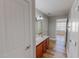 Bathroom features double sinks on wood vanity, ample lighting, and modern fixtures at 1171 Jackson Ct, Creedmoor, NC 27522