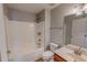 Bright bathroom boasts a shower-tub combo, white finishes and vanity with a classic single sink at 1171 Jackson Ct, Creedmoor, NC 27522