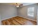 Neutral bedroom with hardwood floors and a bright window, offering a calming retreat at 1171 Jackson Ct, Creedmoor, NC 27522