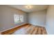 Bright bedroom with hardwood floors, and neutral paint, creating a serene and comfortable retreat at 1171 Jackson Ct, Creedmoor, NC 27522