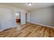 This bright bedroom offers seamless vinyl flooring and access to the ensuite bathroom at 1171 Jackson Ct, Creedmoor, NC 27522