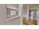 Dining room with wood-look floors, white wainscoting, and a modern light fixture at 1171 Jackson Ct, Creedmoor, NC 27522