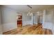 Bright dining room with stylish wainscoting and a view to the kitchen, perfect for entertaining at 1171 Jackson Ct, Creedmoor, NC 27522