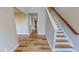 Inviting entryway with wood-look floors leading to an open layout and staircase at 1171 Jackson Ct, Creedmoor, NC 27522