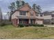 Charming two-story home with a brick facade, a welcoming front porch, and a well-maintained lawn at 1171 Jackson Ct, Creedmoor, NC 27522