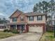 Charming two-story home boasts brick and siding exterior, and a well-manicured front lawn at 1171 Jackson Ct, Creedmoor, NC 27522