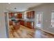 Modern kitchen featuring a center island, stainless appliances, and wooden cabinets at 1171 Jackson Ct, Creedmoor, NC 27522