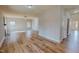 Expansive living room with wood floors, a ceiling fan, and abundant natural light from multiple windows, perfect for gatherings at 1171 Jackson Ct, Creedmoor, NC 27522