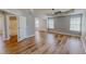 Sunlit main bedroom featuring wood-look floors, a ceiling fan, and ensuite bathroom at 1171 Jackson Ct, Creedmoor, NC 27522