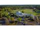 Stunning aerial view of the clubhouse, golf course, and surrounding landscape at 1216 Barcroft Pl, Raleigh, NC 27615