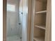 Modern bathroom featuring a glass shower enclosure and neutral shelving at 1216 Barcroft Pl, Raleigh, NC 27615