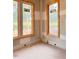 Unfinished bedroom with three windows and natural light during construction at 1216 Barcroft Pl, Raleigh, NC 27615
