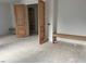 Stylish wood doors lead into a room with custom shelving, offering both beauty and functionality at 1216 Barcroft Pl, Raleigh, NC 27615