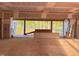 Unfinished room with large picture window showing green space and natural light at 1216 Barcroft Pl, Raleigh, NC 27615
