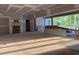 Unfinished room with fireplace featuring new window frames and natural light at 1216 Barcroft Pl, Raleigh, NC 27615