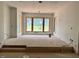 Spacious living room under construction showcasing large windows overlooking green yard at 1216 Barcroft Pl, Raleigh, NC 27615