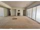 Under-construction living room with fireplace, large windows, and open floor plan at 1216 Barcroft Pl, Raleigh, NC 27615