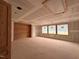 Future living room or great room under construction with three windows and a wood accent wall at 1216 Barcroft Pl, Raleigh, NC 27615
