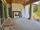Partially finished outdoor living space with fireplace, and sliding doors at 1216 Barcroft Pl, Raleigh, NC 27615